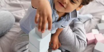 Stacking Up Success: The Power of Montessori Stacker Toys and Activity Cubes